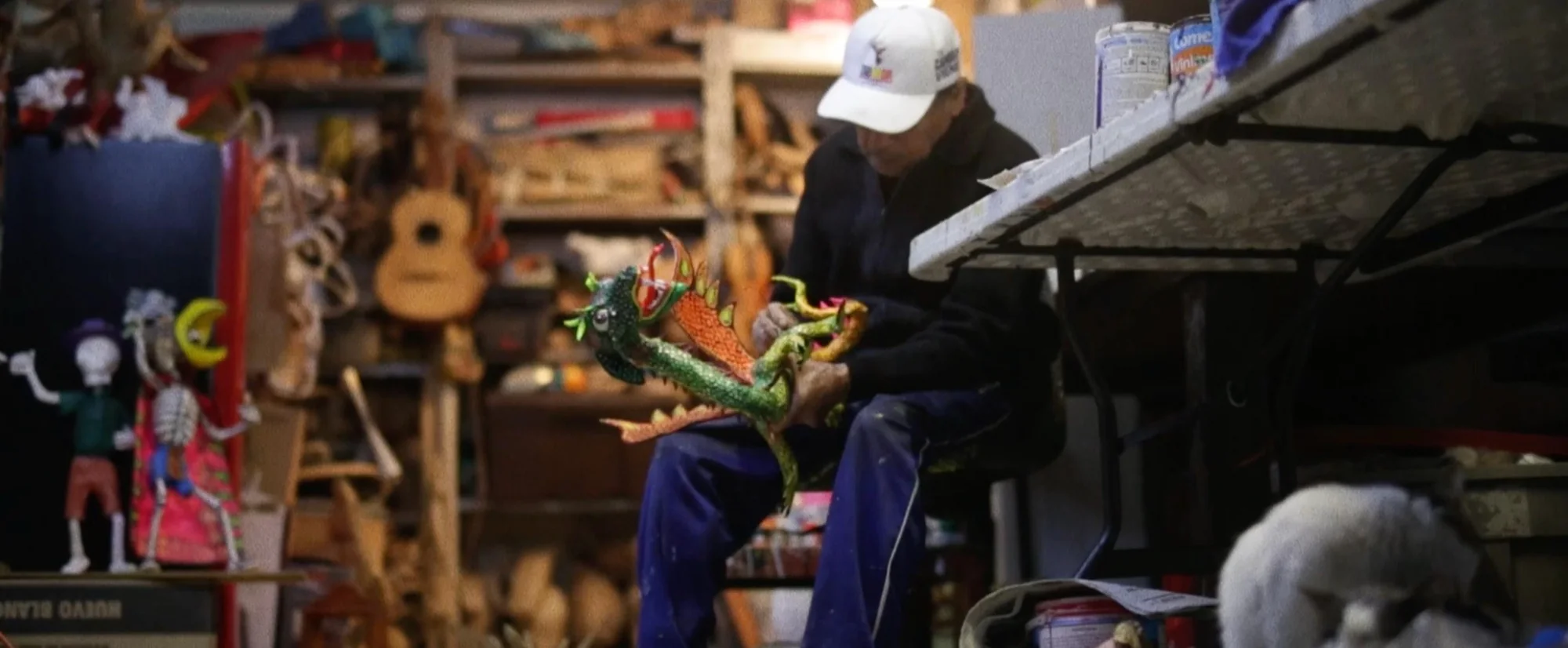 Alebrijes documentary still — artisan carving an alebrije